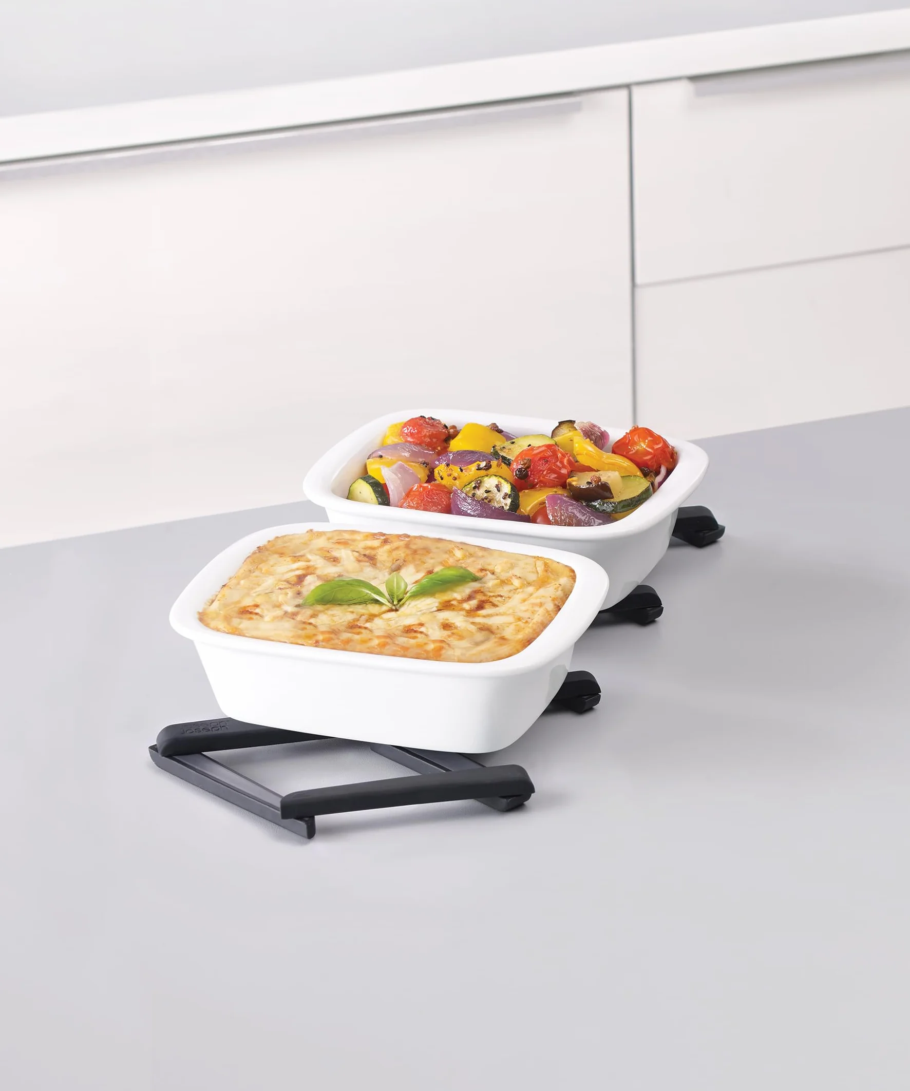 Joseph Joseph Stretch Folding Silicone Trivet do gorących garnków i patelni, rozszerzana podstawka antypoślizgowa, mata żaroodporna na blat kuchenny - czarna